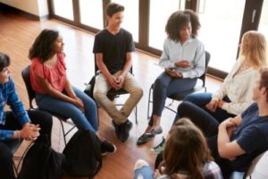 teens sitting in a circle in an aftercare program
