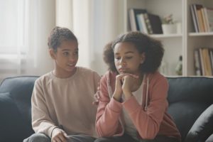 girl and sibling talk about social anxiety in teens
