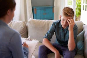 a teen enters a cognitive behavioral therapy program for help with his mental health