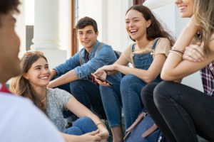 teens support each other in their mental health group therapy program