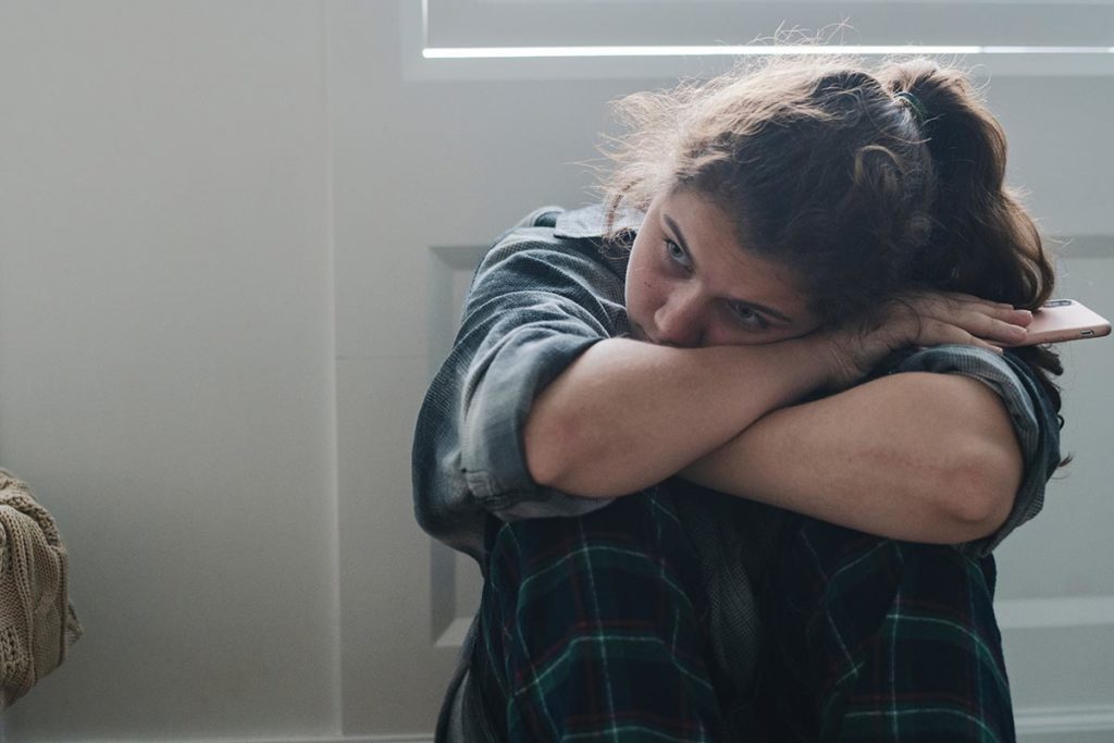 a teen struggles with the symptoms of her ptsd