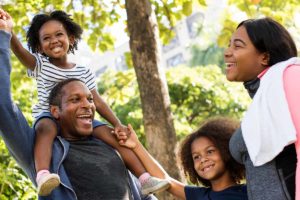 a family enjoys time bonding together with help from a family therapy program