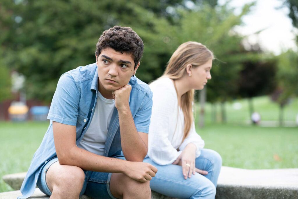 Teen couple struggling with a manipulative relationship