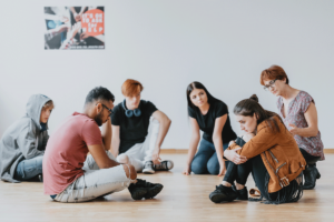 young people in group counseling after learning how to find group therapy in spokane wa